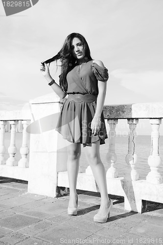 Image of Young woman standing. Black and white concept. 