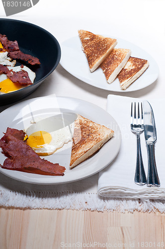 Image of eggs bacon and toast bread