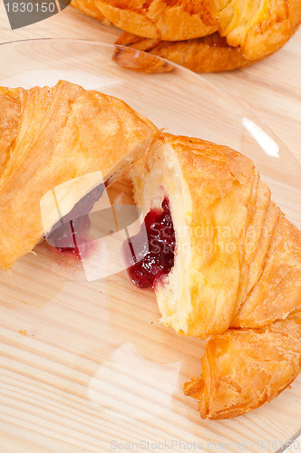 Image of croissant French brioche filled with berries jam