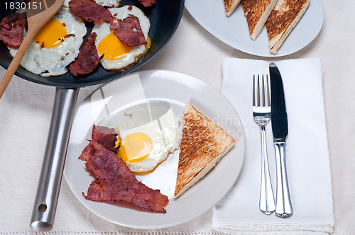 Image of eggs bacon and toast bread