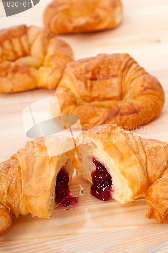 Image of croissant French brioche filled with berries jam