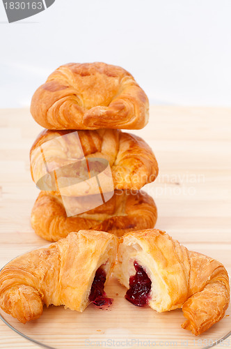 Image of croissant French brioche filled with berries jam