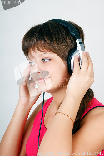 Image of teenage girl listening to music on headphones