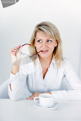 Image of attractive blond girl with a cup of tea