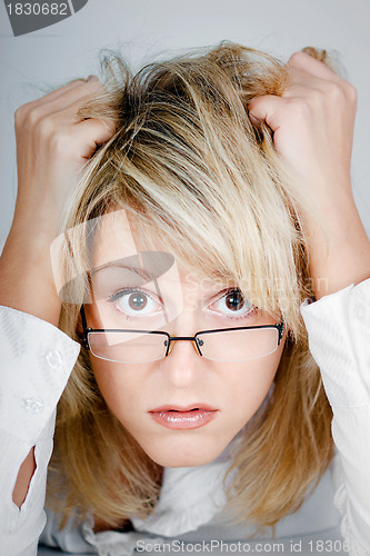 Image of tired young businesswoman