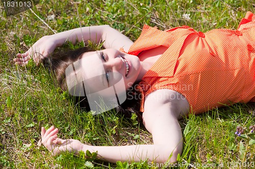 Image of Pretty girl laying on grass