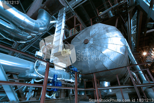 Image of industrial ladders, cables, pipelines in blue tones