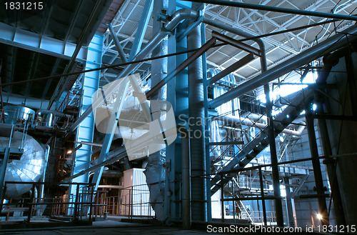 Image of industrial ladders, cables, pipelines in blue tones