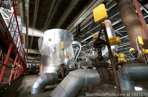 Image of Equipment, cables and piping as found inside of  industrial powe