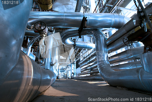 Image of industrial ladders, cables, pipelines in blue tones