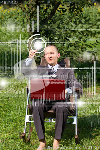 Image of Businessman Working Outdoors
