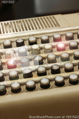 Image of old buttons with two lamps