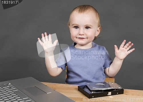 Image of child with open hard drive