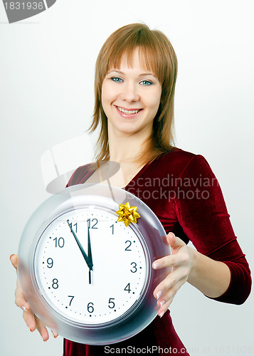 Image of attractive girl with a clock