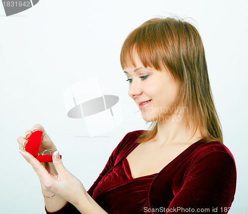Image of girl with a box for rings