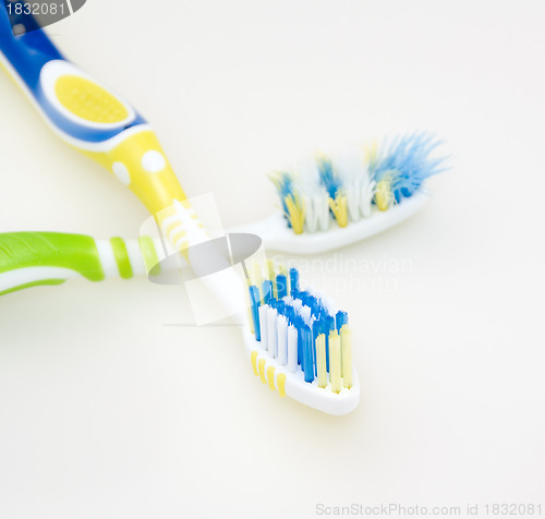 Image of Toothbrushes used and new 