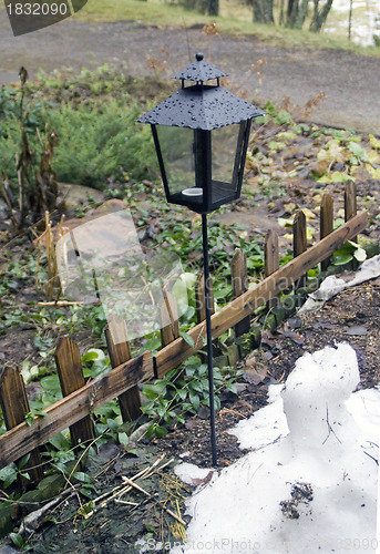 Image of Lantern and small fence on the area