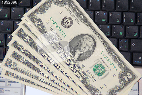 Image of Dollars on the keyboard of laptop