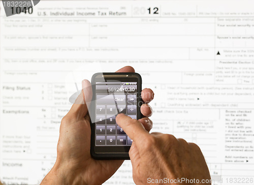 Image of USA tax form 1040 for year 2012 and calculator