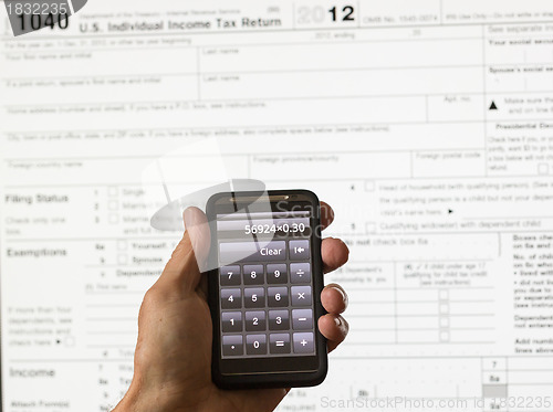 Image of USA tax form 1040 for year 2012 and calculator