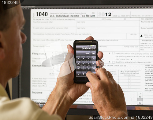 Image of USA tax form 1040 for year 2012 and calculator