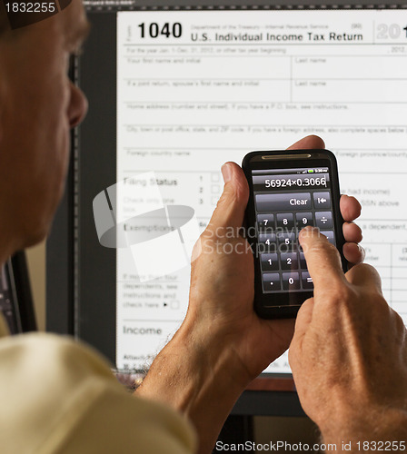 Image of USA tax form 1040 for year 2012 and calculator