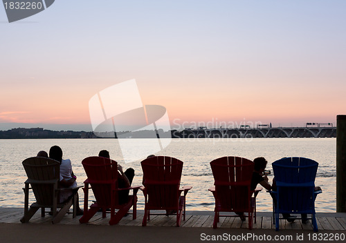 Image of Tourists watch sunset from National Harbor