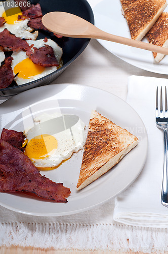 Image of eggs bacon and toast bread