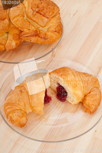 Image of croissant French brioche filled with berries jam