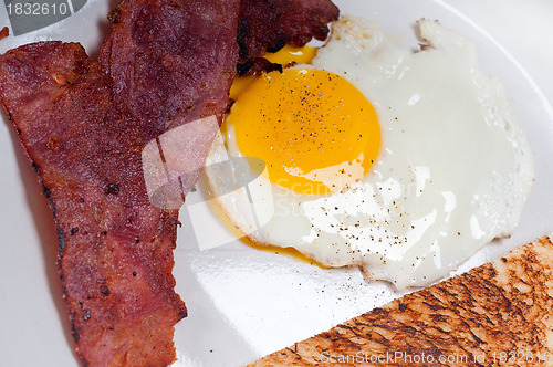 Image of eggs bacon and toast bread