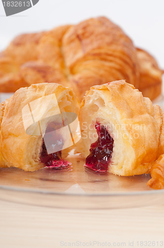 Image of croissant French brioche filled with berries jam