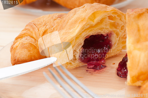 Image of croissant French brioche filled with berries jam