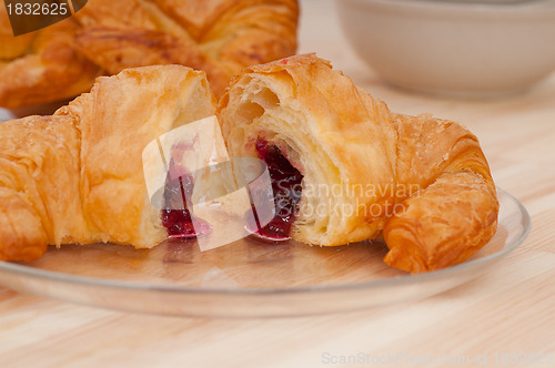 Image of croissant French brioche filled with berries jam