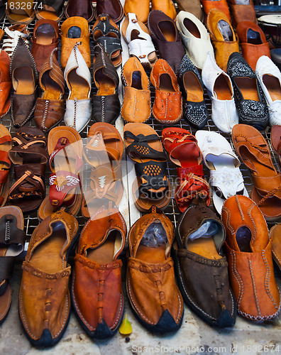 Image of Shoes for sale on a tunisian street 