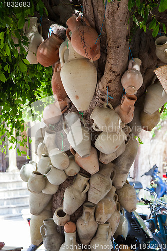 Image of Hanging pots at market, a traditional pottery Tunisia 