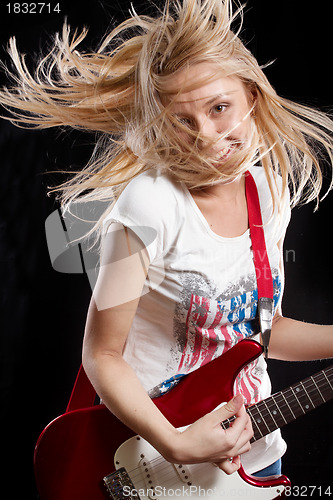 Image of Woman Playing the Guitar