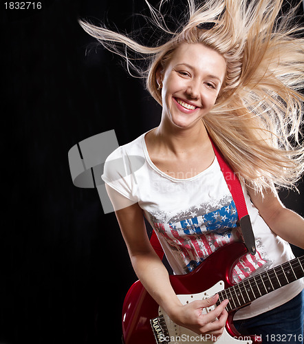 Image of Woman Playing the Guitar