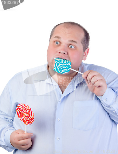 Image of Fat Man in a Blue Shirt, Eating a Lollipop