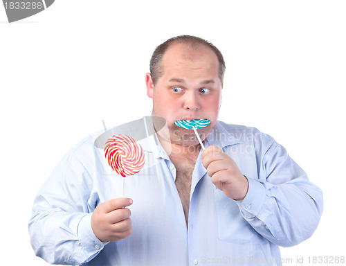 Image of Fat Man in a Blue Shirt, Eating a Lollipop