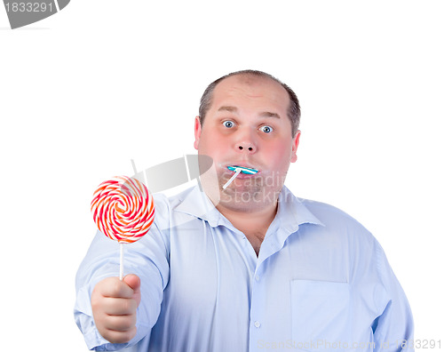 Image of Fat Man in a Blue Shirt, Eating a Lollipop