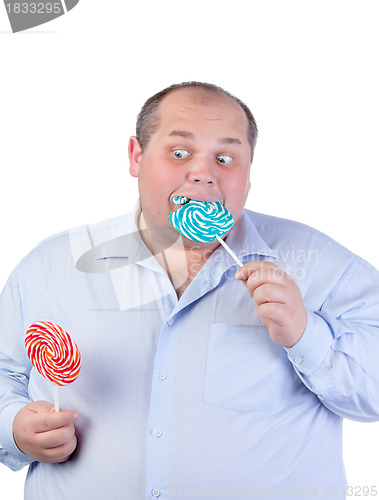 Image of Fat Man in a Blue Shirt, Eating a Lollipop