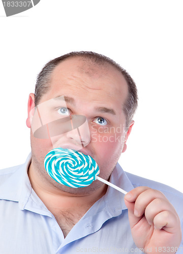Image of Fat Man in a Blue Shirt, Eating a Lollipop