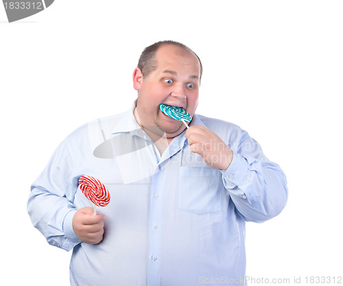 Image of Fat Man in a Blue Shirt, Eating a Lollipop