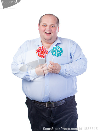 Image of Fat Man in a Blue Shirt, Eating a Lollipop