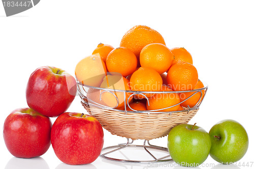 Image of bucket of apples and oranges isolated on white