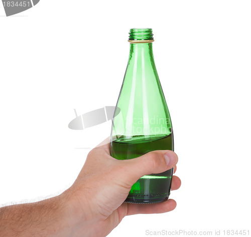 Image of hand holding a bottle of soda water