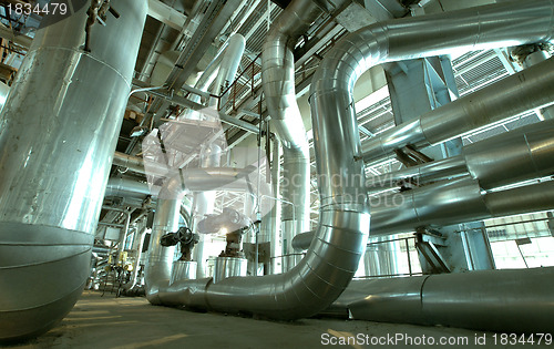 Image of industrial ladders, cables, pipelines in blue tones