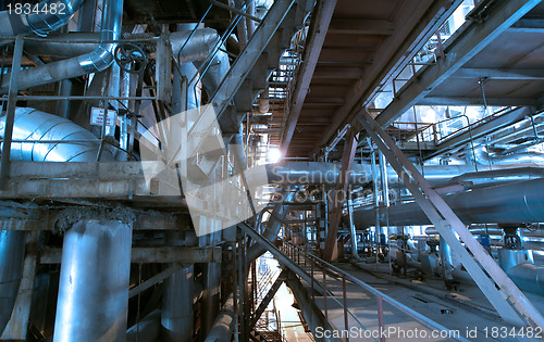 Image of industrial ladders, cables, pipelines in blue tones