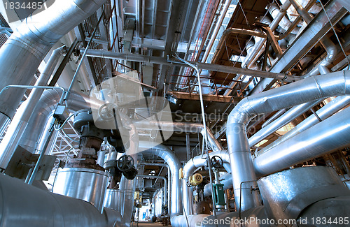 Image of industrial ladders, cables, pipelines in blue tones