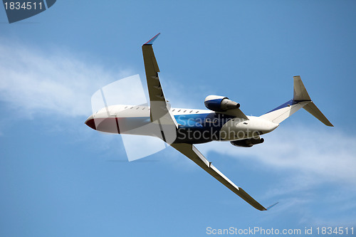 Image of airplane in the blue sky